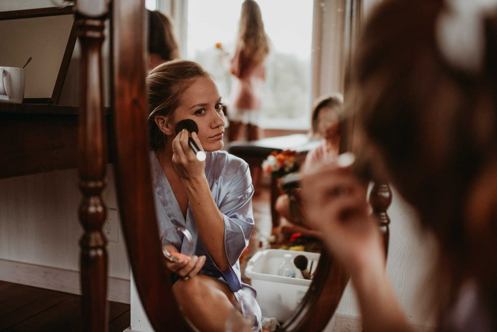 bride getting ready in front of a mirror moody photography, Chicago wedding photography - The Adamkovi