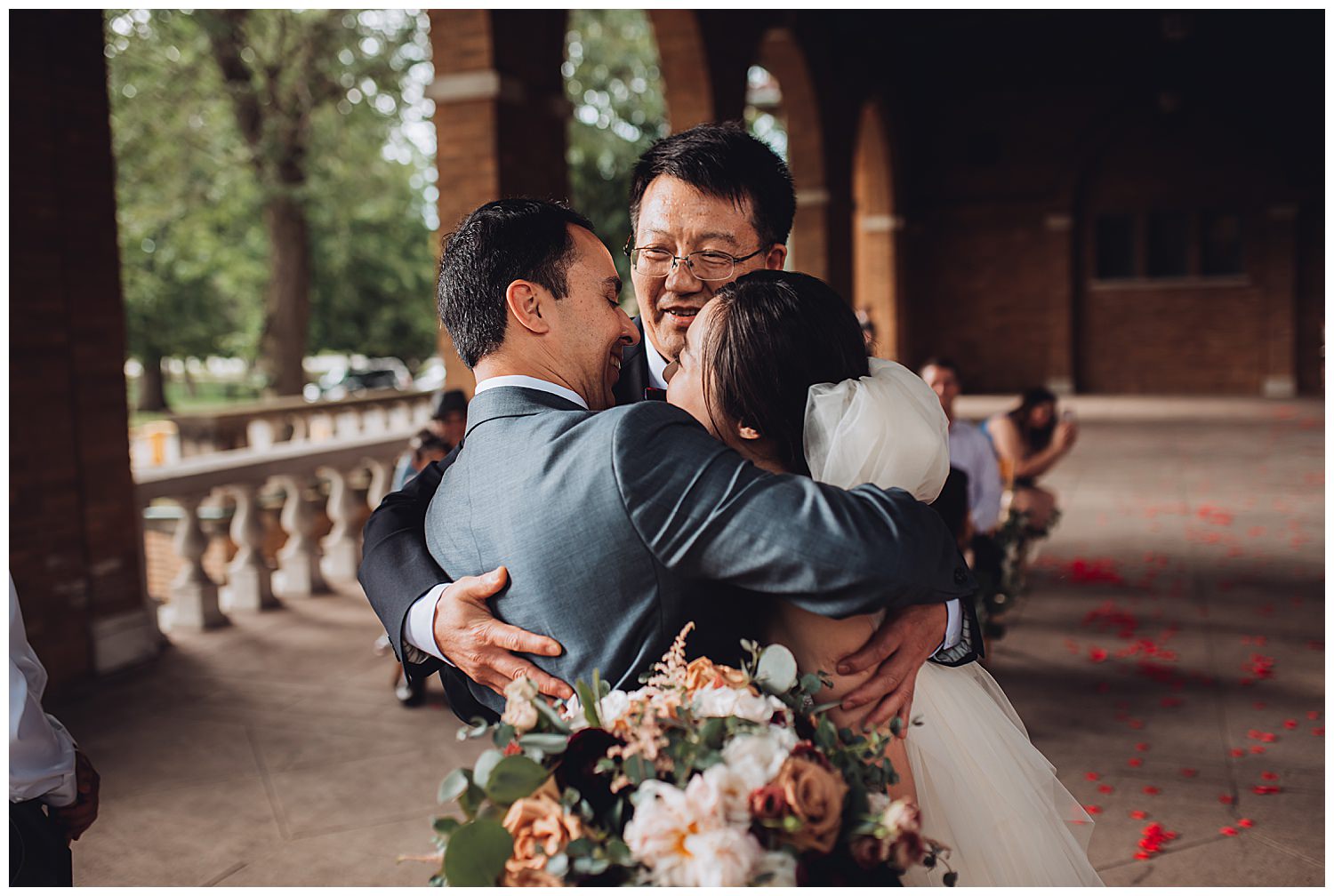 Columbus Park Refectory Wedding, father of the bride hugging the groom and bride