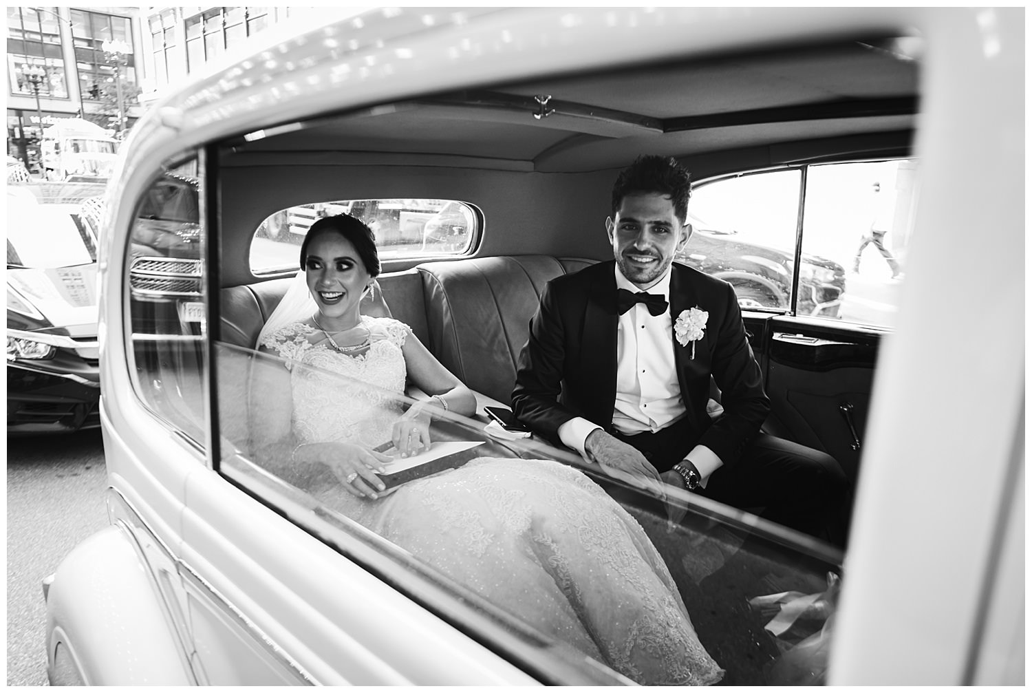 bride and groom in a rolls royce