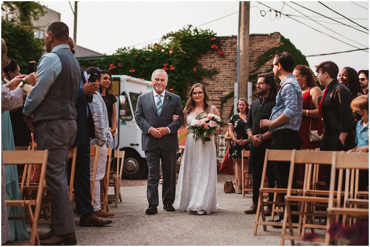 Salvage One documentary Wedding Photography - outdoor bride coming down the isle